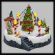 Villaggio h 18,5 cm con albero di natale, pattinatori in movimento e musica